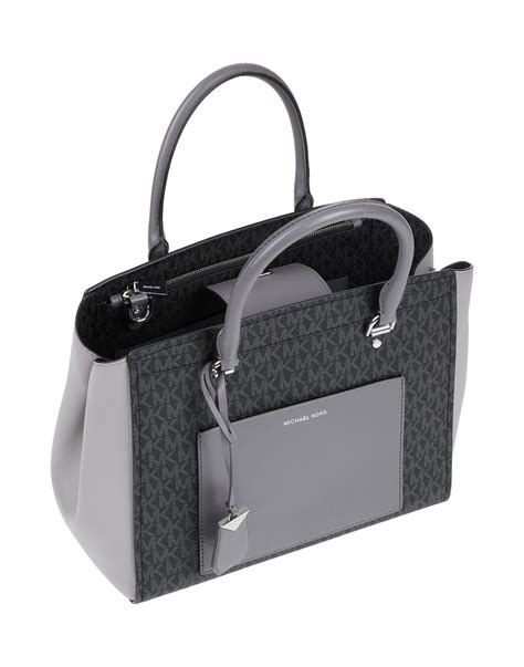 michael kors shoulder tote grey|Michael Kors dark silver wallet.